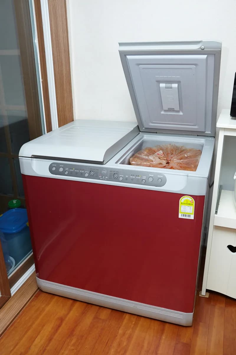 A freestanding kimchi refrigerator in a Korean home